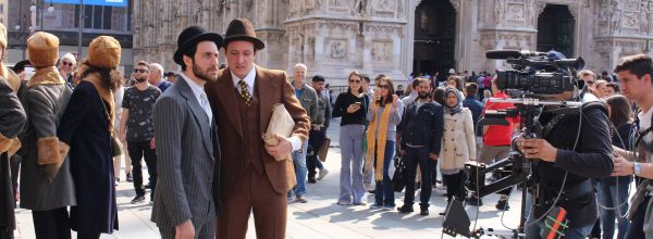 MILAN, ITALY - APRIL 15, 2017: Unidentified actors shooting a history film at Piazza del Duomo square in front of Milan Cathedral (Duomo di Milano).